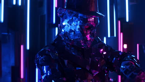 The-camera-follows-a-dynamically-dancing-Mesmerizing-glittering-robot-man-on-a-neon-wall.-Beautiful-dance-show.